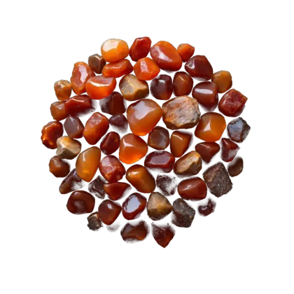 A heaped arrangement of carnelian: translucent tumbled stones and raw pieces glowing in apricot, burnt orange and deep red-brown.