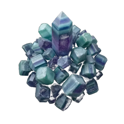 A cluster of fluorite: banded cubes and octahedra in green, purple and blue, glassy and translucent against near-black.