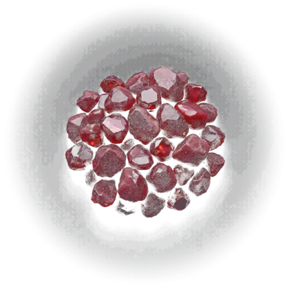 A cluster of garnet: deep red rough crystals in matrix and polished tumbled stones, glowing wine-dark against near-black.