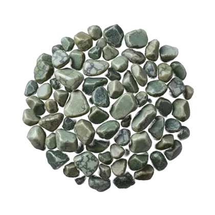 A gathered group of serpentine: waxy green polished pieces mottled and veined in light and dark green, snakeskin-patterned.